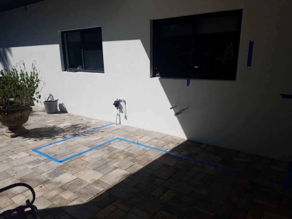 area taped off for outdoor kitchen installation