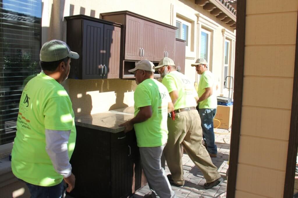 outdoor cabinets with granite countertops being installed