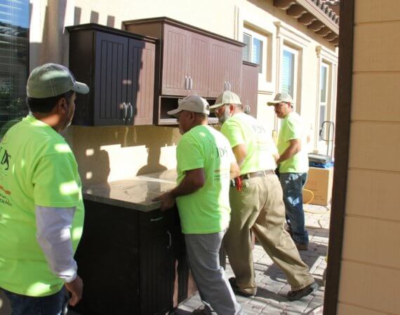 outdoor cabinets with granite countertops being installed