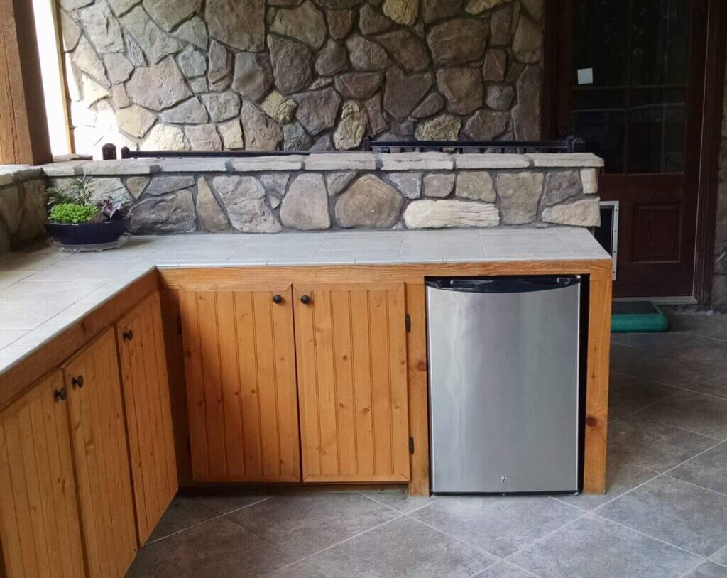 under-counter refrigerator in outdoor kitchen