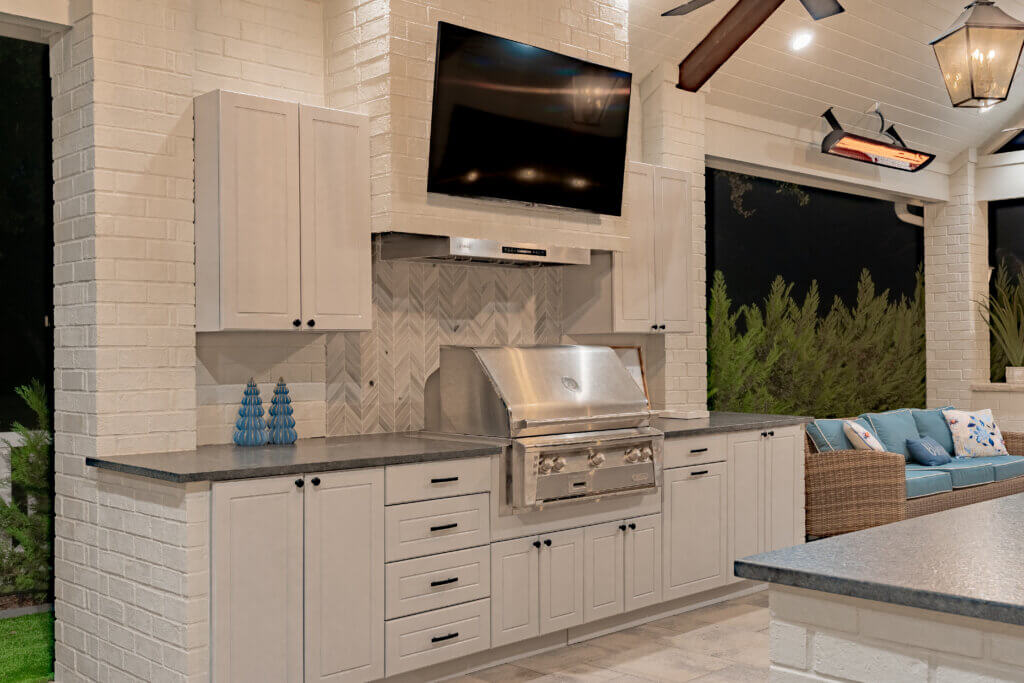 Luxury White Outdoor Kitchen at Night
